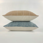 Small stack of throw pillows on a white background