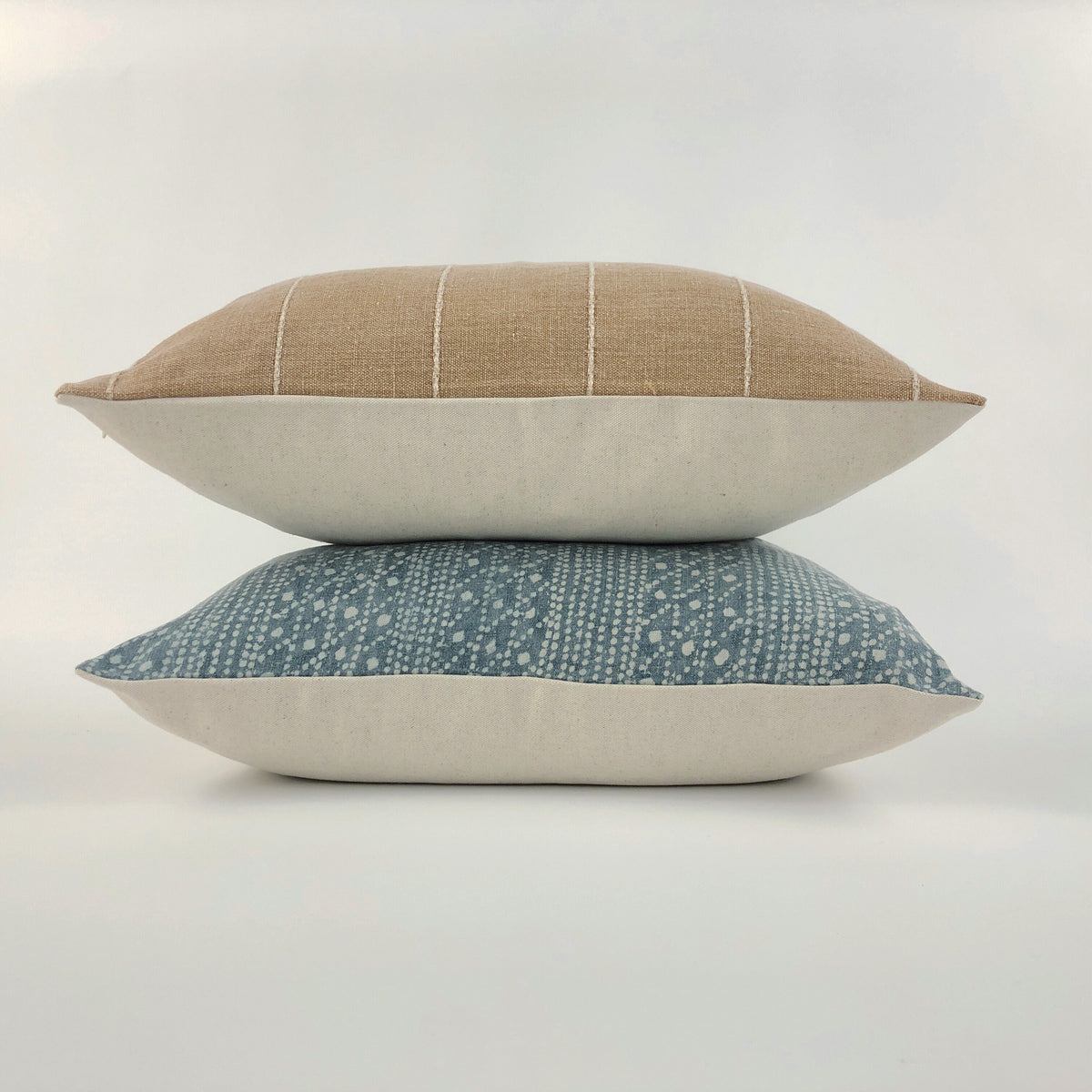 Small stack of throw pillows on a white background