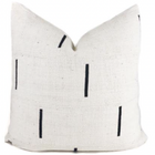 a mudcloth pillow that is black and white