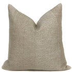 a tan pillow with a white backround