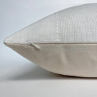a zipper on a white pillow
