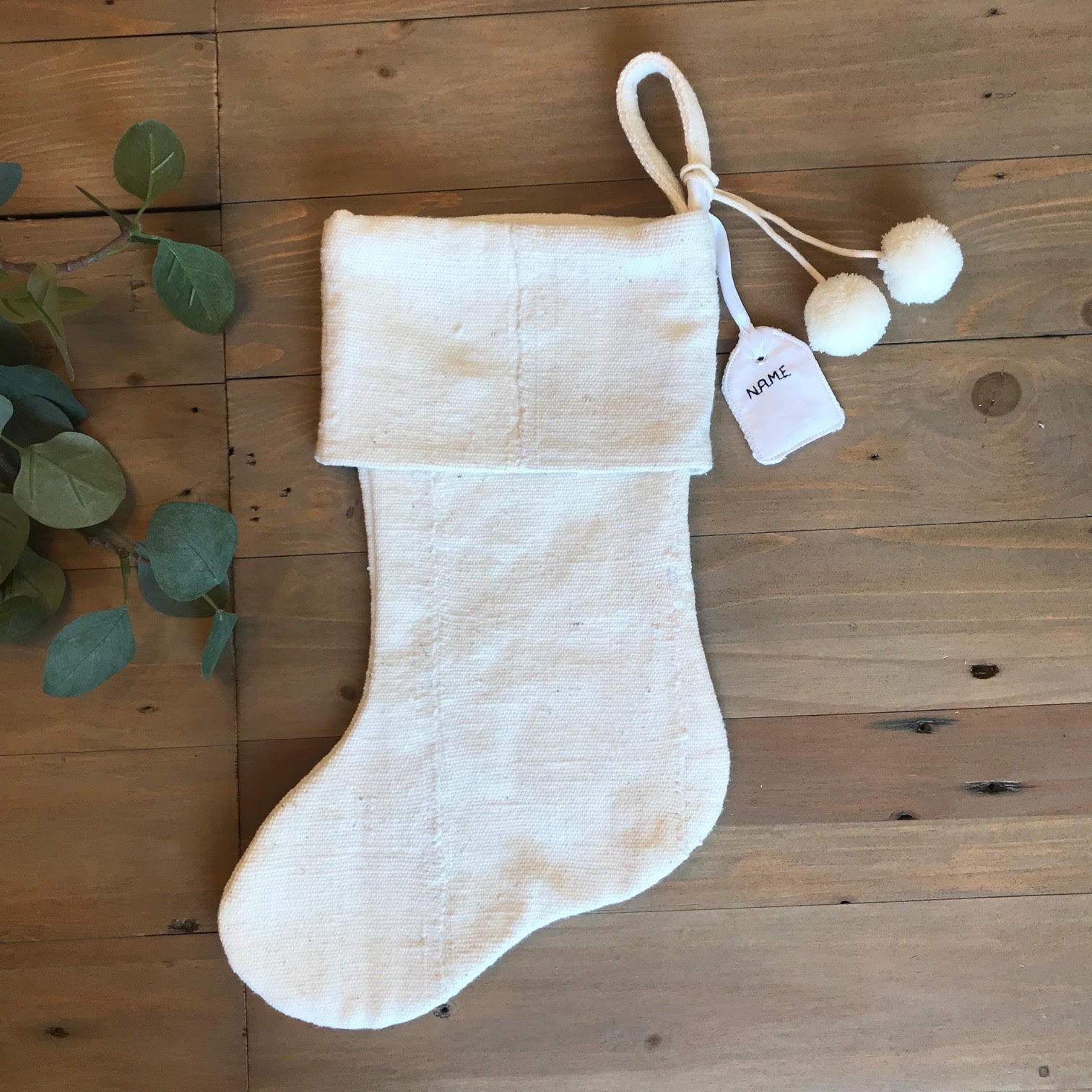 a white mudcloth stocking