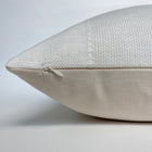 a zipper side of a white pillow