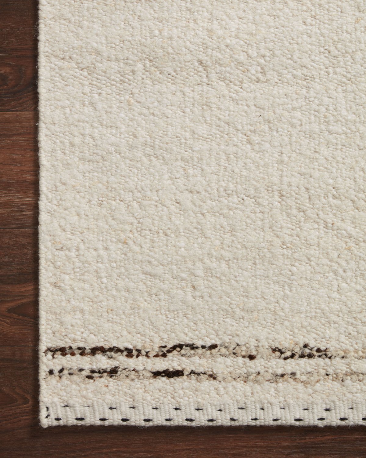 Athena cream and wood rug, corner close-up